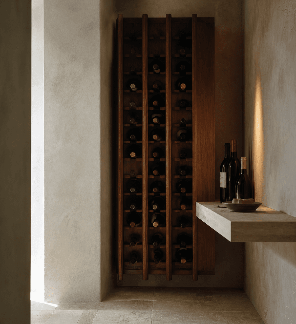 A quiet residential wine cellar in walnut and warm plaster